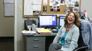 lady smiling in chair