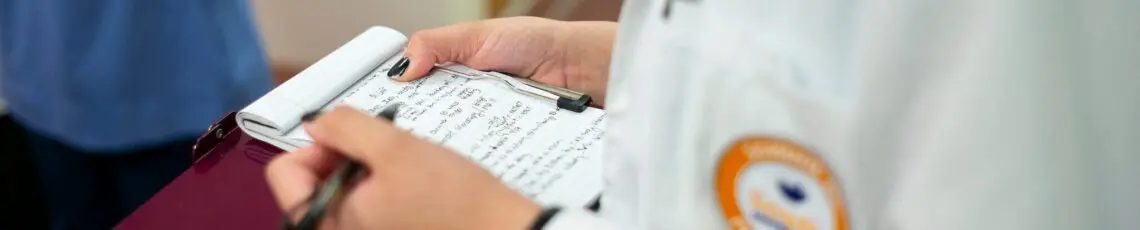 Staff taking notes at hospital