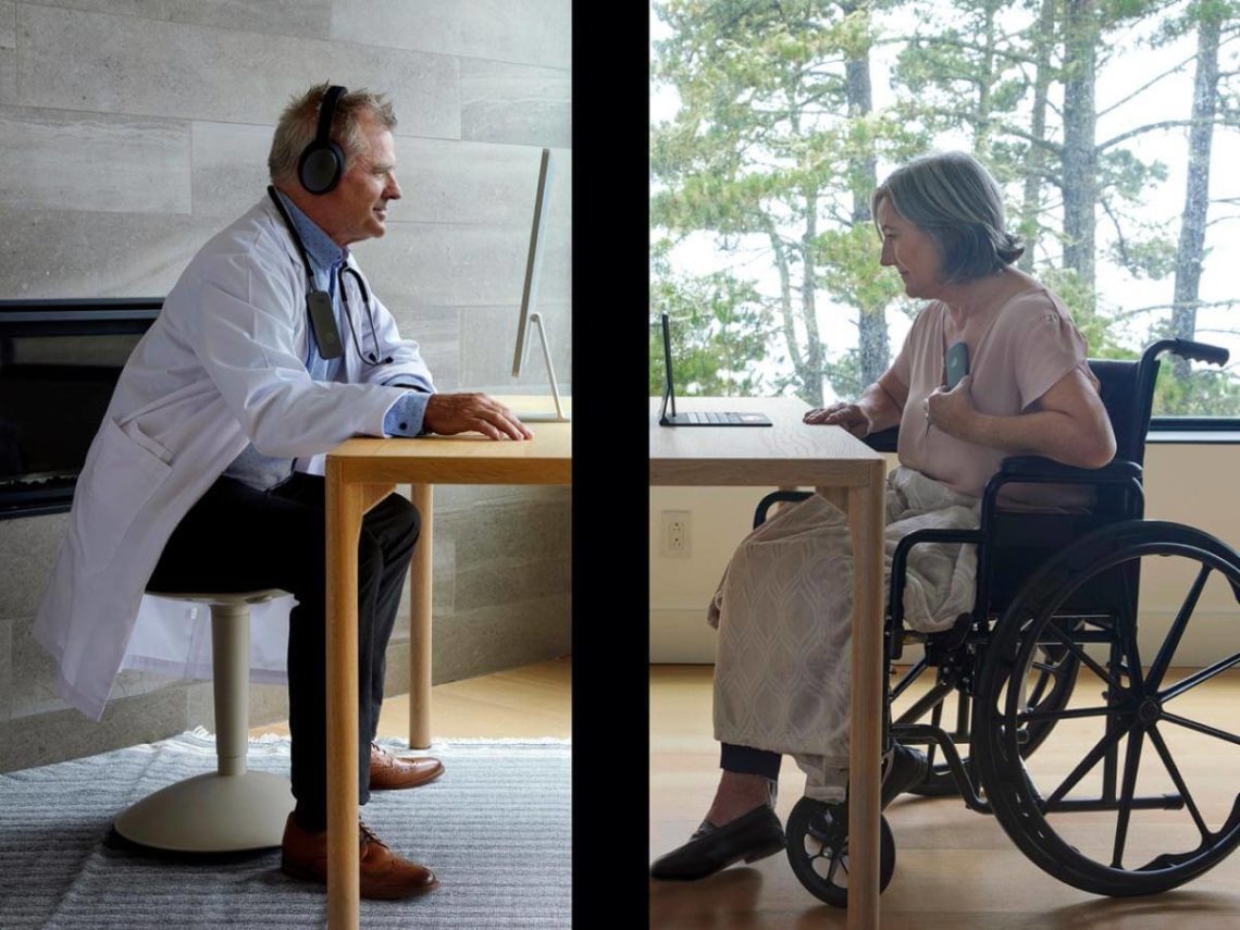 Doctor and patient on computer at table